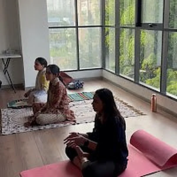 Meditation class on mats near the window