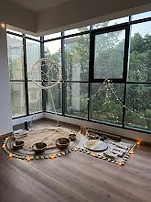 Evening sound bath set up in the corner of the studio
