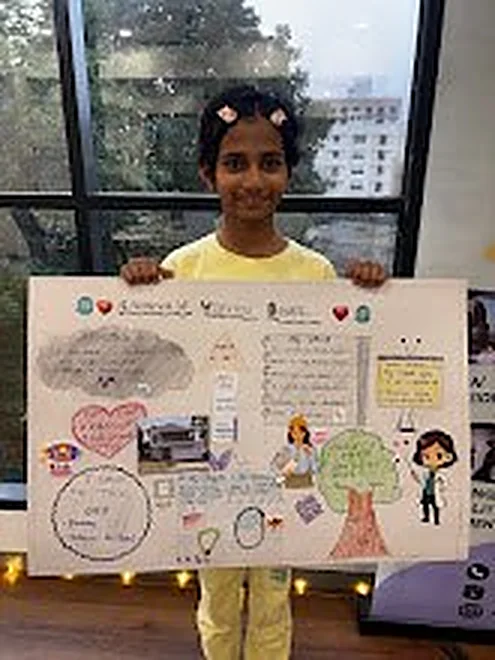 Child with a vision board chart