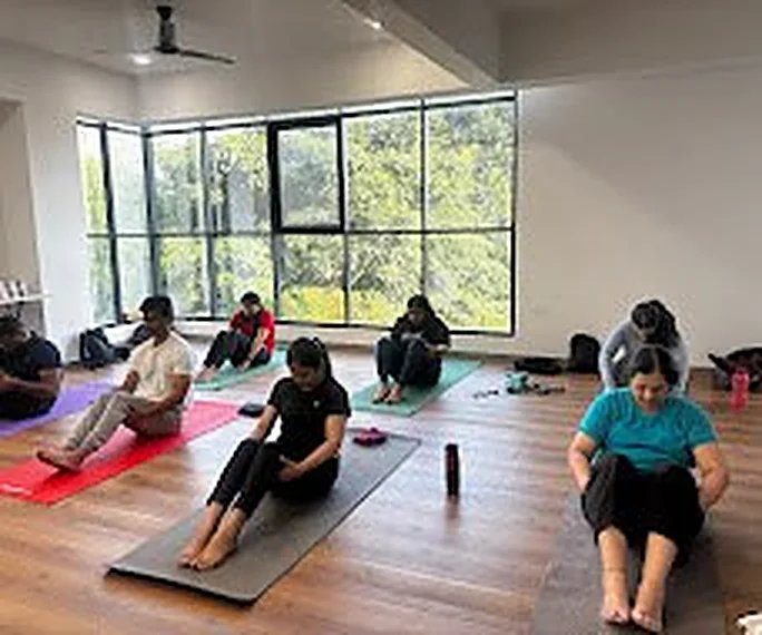 Yoga class in progress on mats